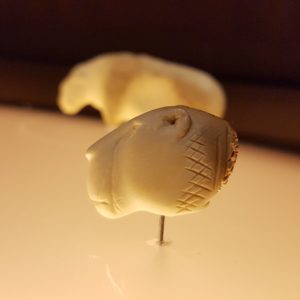 The lion head (picture shows a replica) from the Vogelherd cave is a animal shaped figure carved from mammoth ivory, which was excavated in the cave "Vogelherd" at the southern foot of the Swabian Alb in Germany. The figurine is up to approx. 40,000 years old and one example of the many finds of similar figurines in the region which mark the oldest known creative works of early humans.